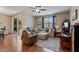 Comfortable living room with hardwood floors and a cozy seating area at 37166 N El Morro Trl, San Tan Valley, AZ 85140
