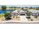 Stunning home featuring mature landscaping and waterfront views in a desirable neighborhood at 37456 W Vera Cruz Dr, Maricopa, AZ 85138