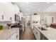 Modern kitchen featuring an island with seating, stainless steel appliances, and sleek cabinetry at 37456 W Vera Cruz Dr, Maricopa, AZ 85138