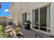 Relax on this brick patio with outdoor dining, grill and view through sliding glass doors into the living room at 3863 S Posse Trl, Gilbert, AZ 85297