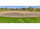 Well-maintained community basketball court with multiple hoops and green space at 3863 S Posse Trl, Gilbert, AZ 85297