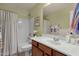 Well-lit bathroom with a shower-tub combo, vanity, and mirror at 3863 S Posse Trl, Gilbert, AZ 85297