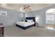 Spacious bedroom with a king-size bed, neutral decor, and ample natural light at 3863 S Posse Trl, Gilbert, AZ 85297