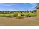 Beautifully landscaped park with walking path and a well-maintained lawn at 3863 S Posse Trl, Gilbert, AZ 85297