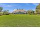 Wide lawn view of community center building and landscaping, great for outdoor activities at 3863 S Posse Trl, Gilbert, AZ 85297
