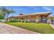 Exterior view of Power Ranch community recreation center on a large green lawn under a clear, blue sky at 3863 S Posse Trl, Gilbert, AZ 85297