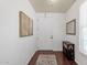 Bright entryway featuring hardwood floors, neutral paint, and classic decor, leading into the home at 3863 S Posse Trl, Gilbert, AZ 85297