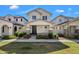 Charming two-story home featuring a welcoming front porch with stone accents and manicured landscaping at 3863 S Posse Trl, Gilbert, AZ 85297