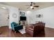 Comfortable living room with hardwood floors, cozy seating, and an open layout to the staircase at 3863 S Posse Trl, Gilbert, AZ 85297