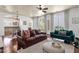 Inviting living room featuring an open floor plan, modern furnishings, and hardwood floors at 3863 S Posse Trl, Gilbert, AZ 85297