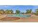Gathering pool with colorful water features for , surrounded by lounge chairs at 3863 S Posse Trl, Gilbert, AZ 85297