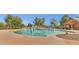 Gathering pool with colorful water features for , surrounded by lounge chairs at 3863 S Posse Trl, Gilbert, AZ 85297