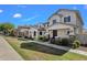 Pleasant street view showcasing homes with covered entries, stone pillars, and well-kept lawns at 3863 S Posse Trl, Gilbert, AZ 85297