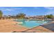 Inviting community pool featuring clear blue water, comfortable lounge chairs, and shaded cabanas at 3863 S Posse Trl, Gilbert, AZ 85297