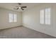 Spacious bedroom with natural light and neutral carpet at 40759 W Bravo Dr, Maricopa, AZ 85138