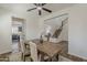 Charming dining area provides convenient access to the kitchen and a staircase leading upstairs at 40759 W Bravo Dr, Maricopa, AZ 85138