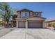 Stunning two-story home with neutral stucco, three gables, and a convenient three-car garage at 40759 W Bravo Dr, Maricopa, AZ 85138