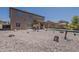 Spacious home featuring a covered patio, desert landscaping, swimming pool and stunning water views at 40759 W Bravo Dr, Maricopa, AZ 85138