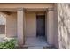 Covered porch with tan pillars provides a sheltered entrance to the home's front door at 40759 W Bravo Dr, Maricopa, AZ 85138