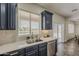 Kitchen sink with modern fixtures, views to the water and stainless steel dishwasher at 40759 W Bravo Dr, Maricopa, AZ 85138