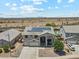 Excellent aerial view showcasing the home with solar panels in its desert surroundings at 4118 N 304Th Ln, Buckeye, AZ 85396