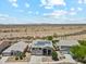 Overhead view of desert home showcasing ample desert space and serene mountain views at 4118 N 304Th Ln, Buckeye, AZ 85396