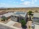 Aerial view of a home with a well-manicured front yard and desert scenery at 4118 N 304Th Ln, Buckeye, AZ 85396