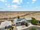Aerial view showcasing the neighborhood and vastness of the surrounding desert landscape at 4118 N 304Th Ln, Buckeye, AZ 85396