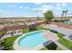 Aerial view of backyard featuring a pristine pool and desert landscape at 4118 N 304Th Ln, Buckeye, AZ 85396