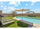 Inviting backyard with a pool, lounge chairs, and desert views at 4118 N 304Th Ln, Buckeye, AZ 85396