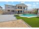 Spacious backyard featuring a pool, patio, and a well-maintained lawn at 4118 N 304Th Ln, Buckeye, AZ 85396