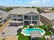 Aerial perspective showing a large backyard with a pool, outdoor kitchen, and play area at 4118 N 304Th Ln, Buckeye, AZ 85396