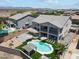 Aerial view of the home's backyard featuring a pool, lounge chairs, dining, and playground at 4118 N 304Th Ln, Buckeye, AZ 85396