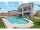 Large backyard with a sparkling pool, lush lawn, and plenty of space for relaxation at 4118 N 304Th Ln, Buckeye, AZ 85396
