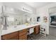 Large bathroom featuring dual sinks, vanity seating, and a glass-enclosed shower at 4118 N 304Th Ln, Buckeye, AZ 85396