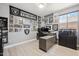 Bedroom featuring Raiders themed decorations, grey walls and light flooring at 4118 N 304Th Ln, Buckeye, AZ 85396