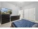 Comfortable bedroom features a full-sized bed and wood-look floors at 4118 N 304Th Ln, Buckeye, AZ 85396
