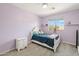 Charming bedroom featuring a lavender wall and plush gray carpeting at 4118 N 304Th Ln, Buckeye, AZ 85396
