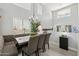 Dining room showcasing high ceilings, ample natural light, and a cozy built-in bench at 4118 N 304Th Ln, Buckeye, AZ 85396