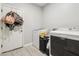Laundry room with washer and dryer hookups and door at 4118 N 304Th Ln, Buckeye, AZ 85396