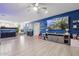 Inviting living area with a vibrant blue accent wall, modern furniture, and an open floor plan at 4118 N 304Th Ln, Buckeye, AZ 85396
