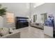 Bright living room featuring neutral decor and a large aquarium at 4118 N 304Th Ln, Buckeye, AZ 85396