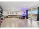 Spacious living room with modern flooring, a large sectional, and access to the outdoor space at 4118 N 304Th Ln, Buckeye, AZ 85396
