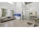 Bright living room with high ceilings, neutral decor, and a large aquarium at 4118 N 304Th Ln, Buckeye, AZ 85396