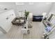 Aerial view of living space with an aquarium and sectional sofa and dining area at 4118 N 304Th Ln, Buckeye, AZ 85396