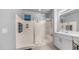 Modern bathroom featuring glass shower, sink with vanity, and neutral tones at 4341 W Pelotazo Way, San Tan Valley, AZ 85144