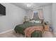 Cozy bedroom featuring carpet floors, neutral walls, and a comfortable-looking bed with ample natural light at 4341 W Pelotazo Way, San Tan Valley, AZ 85144