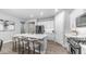 An open-concept kitchen with an island, pendant lighting, and stainless steel appliances at 4341 W Pelotazo Way, San Tan Valley, AZ 85144
