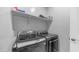 Well-lit laundry room with shelving and modern LG washer and dryer at 4341 W Pelotazo Way, San Tan Valley, AZ 85144