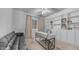Bright home office featuring a built-in bookshelf, modern desk, and comfortable lounge area with natural light at 4341 W Pelotazo Way, San Tan Valley, AZ 85144